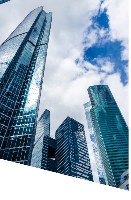 Black and white photograph showcasing towering skyscrapers against a city skyline, emphasizing architectural grandeur.